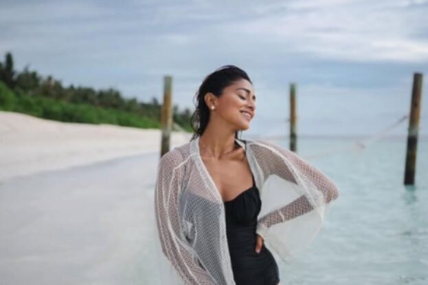 shriya saran black bikini with white coverup beach look