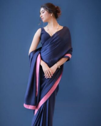 Sara Arjun wearing a blue saree during a studio photoshoot
